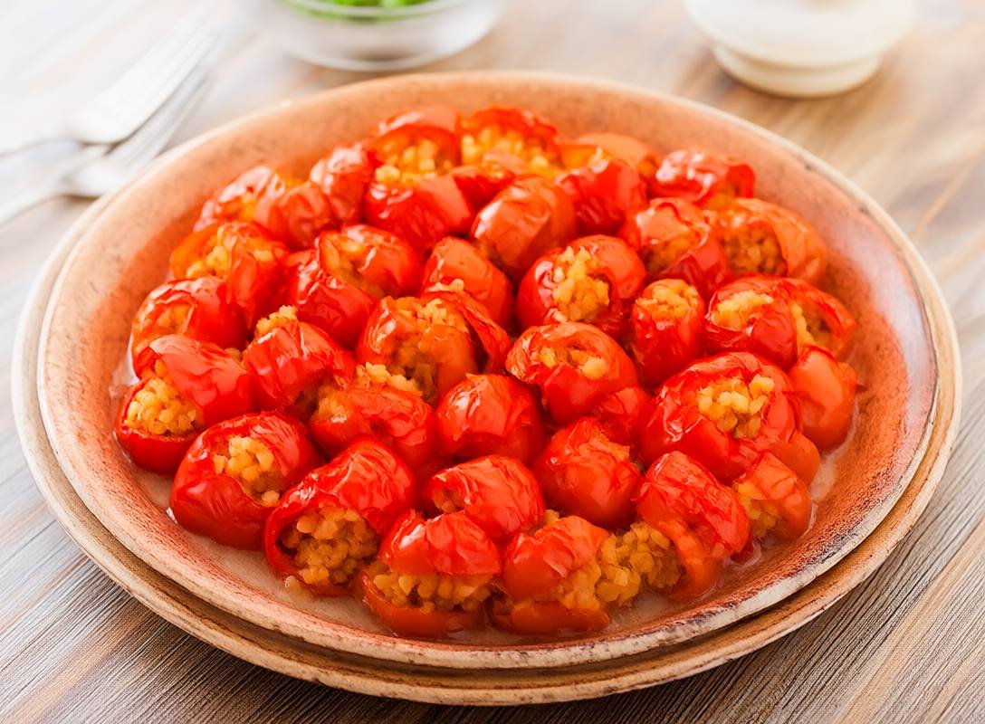 Roasted Bell Peppers Stuffed with Spiced Bulgur and Sweet Dates